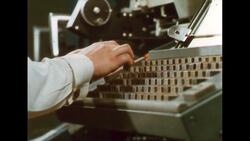UNITED STATES 1960s: Young woman typing. Stock Footage