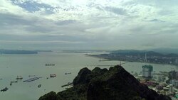 4k Aerial view over city and park with Bai Tho karst mountain Ha long bay. Halong City. Stock Footage