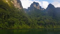 view of landscape limestone mountain rang and green forest with water lake Stock Footage