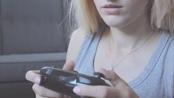 Young woman playing video game Stock Footage