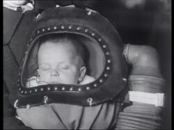 Children in London being evacuated and fitted with gas masks, embarking trains, 1939 Stock Footage
