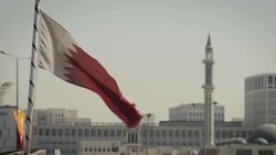 The Qatar flag flying in the wind News Clip