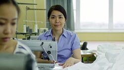Portrait of Professional Seamstress Working at Factory Stock Footage