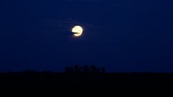 Supermoon sets behind Stonehenge in Wiltshire News Clip