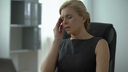 Female company worker typing on laptop, suffering from migraine, tiredness Stock Footage