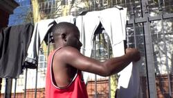 CLEAN : South Africa: refugees camp outside UNHCR headquarters demanding repatriation News Clip