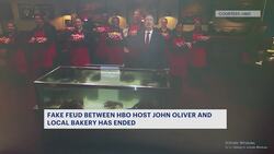 John Oliver eats giant Deising's cake bear, pledges $10K donation to Peoples' Place of Kingston, NY News Clip