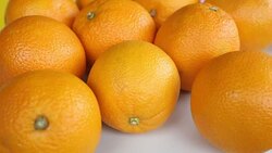 group of oranges on a white rotating plate Stock Footage