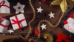 Christmas decoration and gifts on old wooden floor Stock Footage