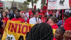 Protesters hound Buttigieg at minimum wage march News Clip
