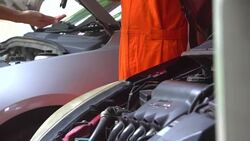 Woman giving keys from car to mechanic Stock Footage