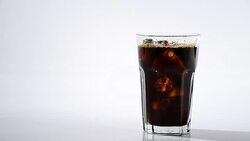 Pouring fresh coffee into glass with ice to make ice americano Stock Footage