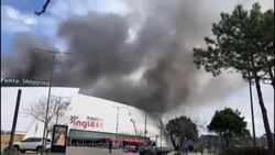 CLEAN : Black smoke rises during a fire at Uruguay shopping centre News Clip