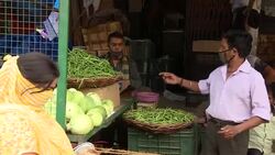 Greengrocer's stall in a busy Delhi marketplace News Clip