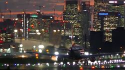 London City Airport with Canary Wharf in the distance Stock Footage