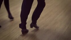 Dancing male and female legs in the dance studio Stock Footage