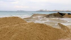 Wide Angle: Sand Being Pumped onto Beach Stock Footage