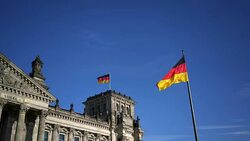 Flag of Germany against the background of the Reichstag Stock Footage