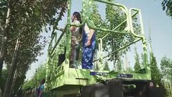 Female gardener gers up on elevator in the garden Stock Footage