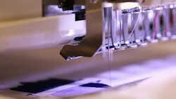 sewing machine or embroidery machine is used to create patterns on textiles Stock Footage