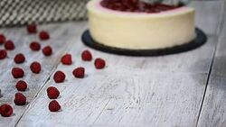 Homemade raspberries mousse cake. Mousse dessert on a black plate. Stock Footage