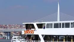 Golden Horn Metro Bridge in Istanbul, steamboats sailing by, tourism in Turkey Stock Footage