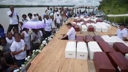 VOICED : Comienza el adios a victimas de matanza ocurrida hace 17 anos en templo de Colombia News Clip