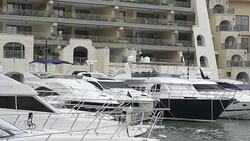 Super yachts moored at Portomaso Marina in St Julian, Malta Stock Footage
