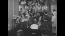 1960s: Men and women celebrate, wave pendants Stock Footage