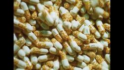 UNITED STATES 1960s: View of pills on conveyor belt. Stock Footage