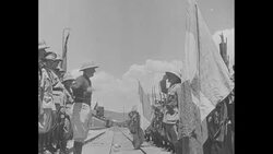 Fascist Italian troops arrive on train and officer reviews troops News Clip