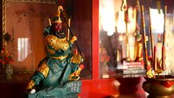 Buddhist traditional statues of chinese sacred gods on the altar inside the temple Stock Footage