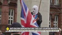 Pro And Anti-Migrant Protesters Face Off At London Hotel Housing Asylum Seekers News Clip