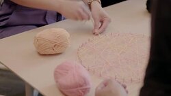 Woman doing art and craft project, assembling string art in office Stock Footage