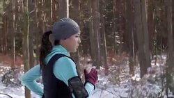 Side view of athlete running in winter Stock Footage