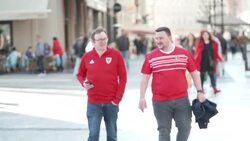 Wales fans walking through the streets of Prague News Clip