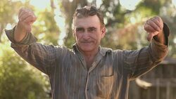 Middle aged farmer on farmland Stock Footage
