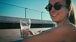 young sexy woman girls enjoying a drink in a luxurious flat water pool Stock Footage