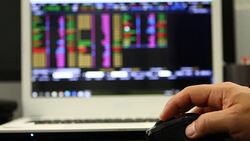 Using laptop trading stock exchange Stock Footage