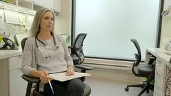 Female doctor with medical record talking in doctors office Stock Footage