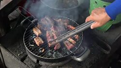 footage of grilling Pork on charcoal grill, Cooking food and barbecue concept Stock Footage