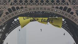 Greenpeace hijacks Eiffel Tower with political protest News Clip