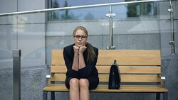 Female office employee sitting on bench, worrying bout troubles at work, stress Stock Footage