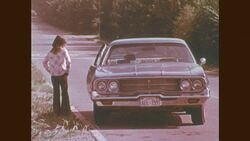 1970s: Car pulls over to child on the side of the road, opens door Stock Footage