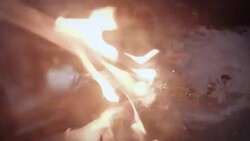 A red-hot steel blade is submerged into liquid, producing steam and flames. Stock Footage