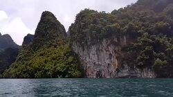 Moving follow boat with Beautiful mountains lake river sky and natural attractions in Ratchaprapha Dam at Khao Sok National Park, Surat Thani Province, Thailand. Stock Footage