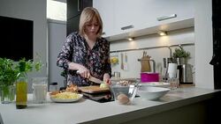 Young woman cutting onion Stock Footage