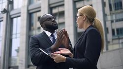 Businessman convinces investor of project profitability, shows income on tablet Stock Footage