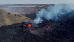 Drone footage of magma flowing from a heart-shaped crater at Fagradalsfjall volcano, Iceland News Clip