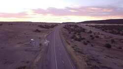 Aerial Drone Footage of Semi-Trucks Rolling Down the Highway Stock Footage
